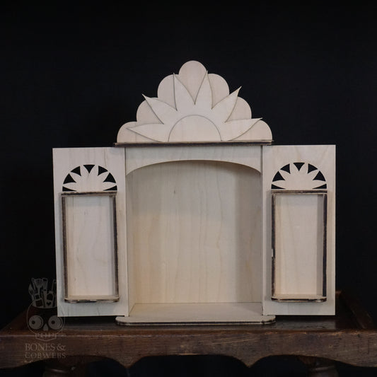 Wooden nicho decorative item with a central arch and side panels on a dark background