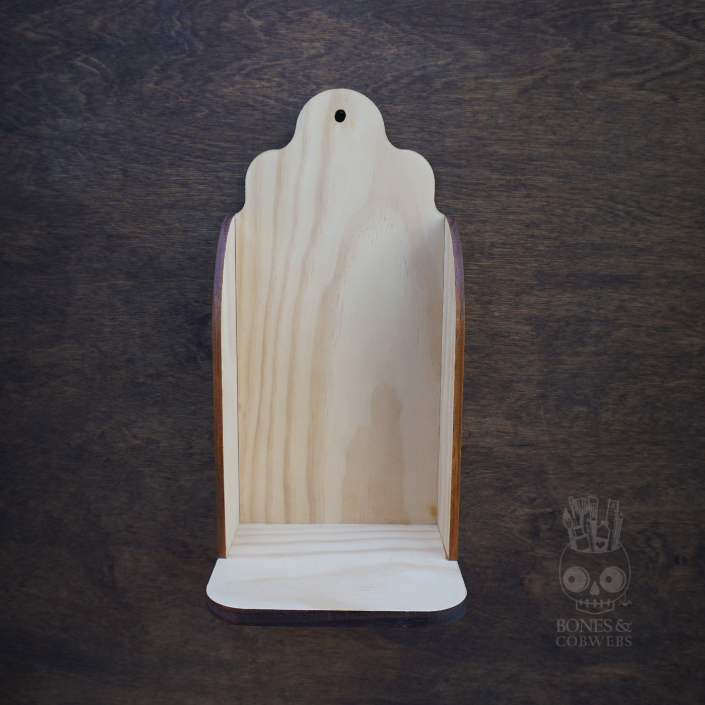 Wooden product display stand on a dark textured background