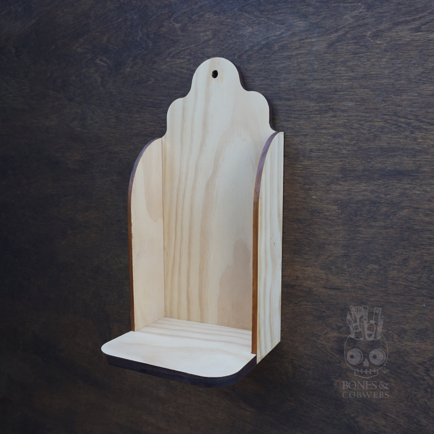 Wooden shelf with a dark background