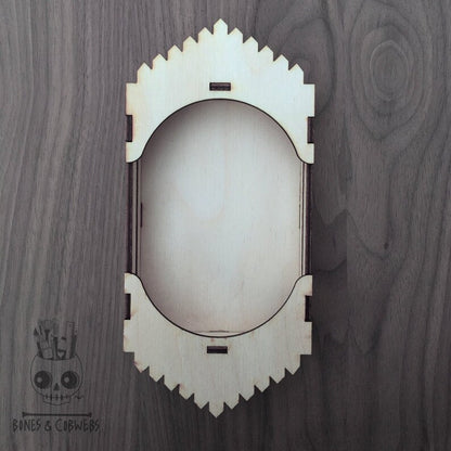 Decorative wooden shadwo box on a wooden background
