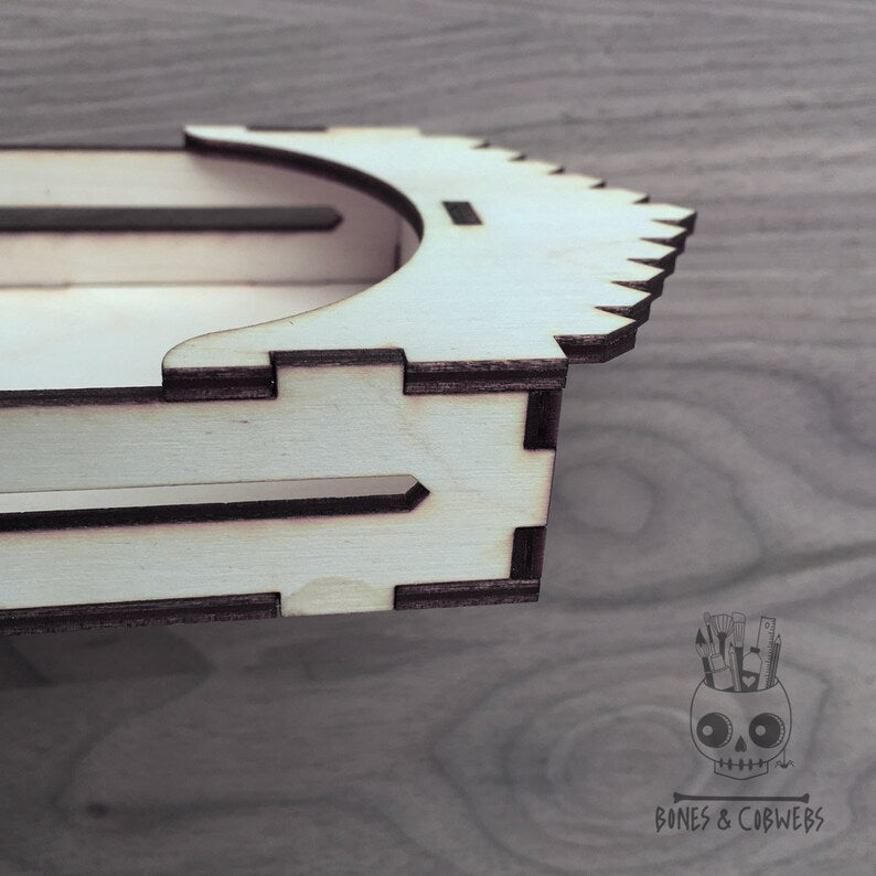 Side view of the wooden shadow box  on a tabletop. 